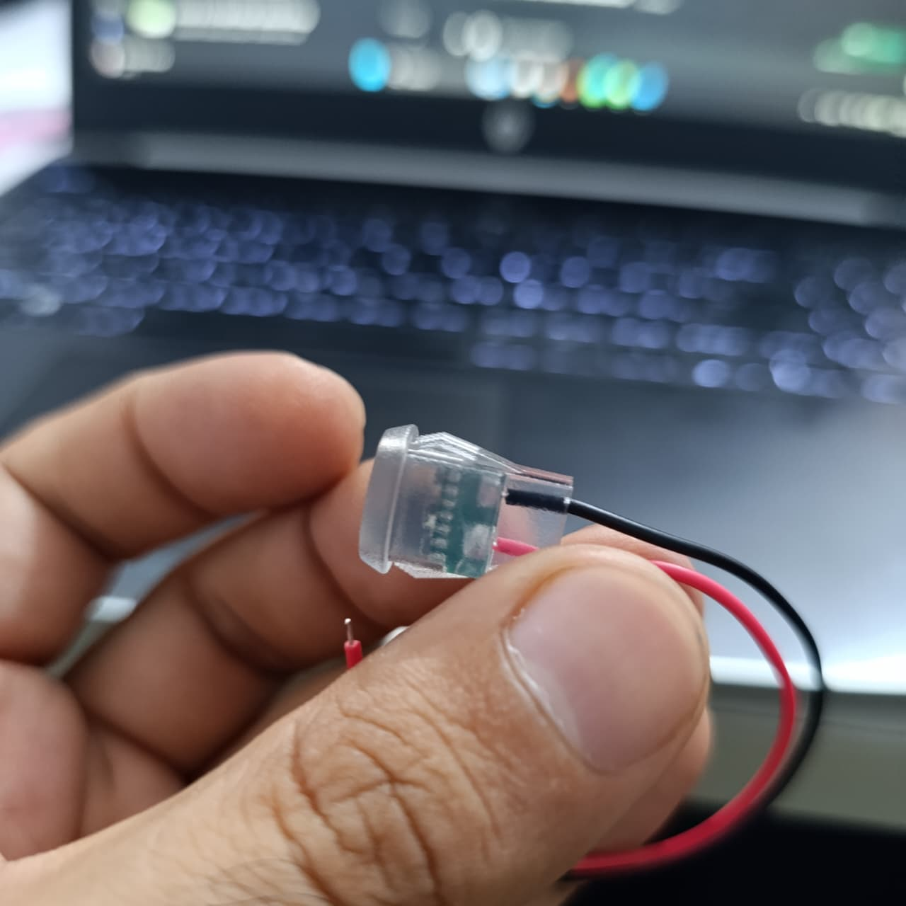 Type-C 2P Round Transparent Green Light USB Female Port – LED Plug-in Type - the clear plastic casing, internal green circuit board, and two wires.