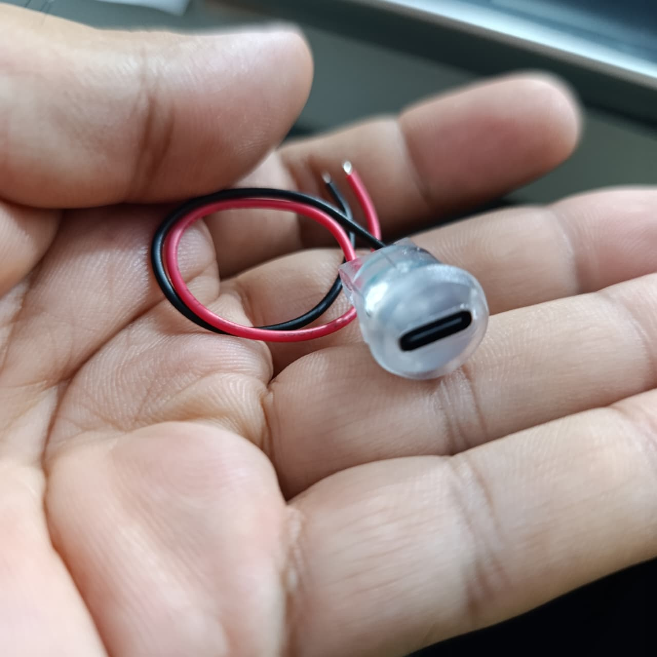 Type-C 2P Round Transparent Green Light USB Female Port – LED Plug-in Type - clear plastic USB-C port with attached red and black wires.