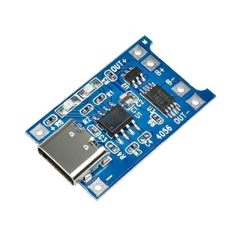 Type C TP4056 Lithium Battery Charging Board 1 Amp - a blue rectangular circuit board with a USB Type-C port, several microchips, and labeled solder pads.