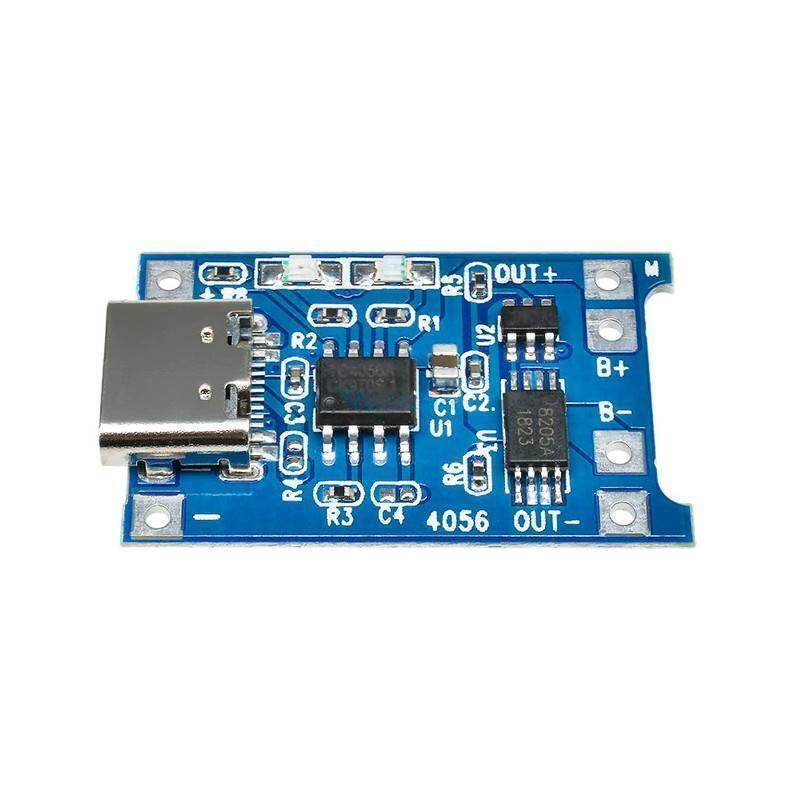 Type C TP4056 Lithium Battery Charging Board 1 Amp - a blue rectangular circuit board featuring a USB-C port, integrated chips, and labeled connection pads.