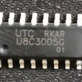 U8C3005G SOP-16 SERIAL IN PARALLEL IC PRICE - a close-up shot of a black, 16-pin integrated circuit chip with white text printed on its surface.