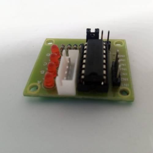 ULN2003 Stepper Motor Driver Board For Arduino Avr SMD - a green rectangular circuit board featuring a black integrated circuit, a white connector, and four red LED indicators.