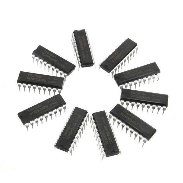 ULN2803 ULN2803A ULN2803A IC - a circular arrangement of nine black, rectangular 18-pin integrated circuit chips with silver metal pins on a white background.