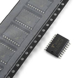 ULN2803A SMD Hi-voltage Current Darlington Transistor Array - shown as a single black surface-mount component next to a plastic tape reel containing multiple identical units.