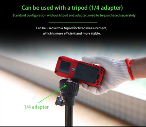 UNI-T LM100G Green Laser Distance Meter – 100 m, ±(2 mm+5×10⁻⁵·D), 515 nm Green Beam, Area / Volume / Pythagoras, Angle Sensor, 2.4" EBTN Display, Rechargeable - in red and black being held by a gloved hand and positioned above a tripod with a 1/4 inch adapter.