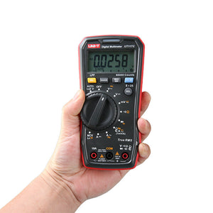 UNI-T UT117C High-Precision True RMS Digital Multimeter – 60000 Count, Bluetooth, LoZ, LPF, AutoVolt, NCV, AC/DC 600V, Capacitance, Frequency, 2m Drop-Proof - held in a hand, showing a black and red handheld device with a digital display reading 0.0258, a dial, and input ports.
