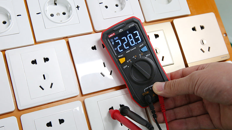 UNI-T UT123 Pocket Residential Digital Multimeter – EBTN Display, AC/DC Voltage, Resistance, Temperature, NCV, Diode & Continuity, One-Hand Design - a black and red casing, a digital screen reading 228.3, a rotary dial, and two test leads.