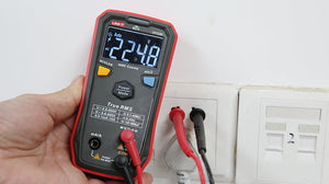 UNI-T UT123D Smart Digital Multimeter – Auto-Identify, EBTN Display, AC/DC Voltage, Capacitance, Resistance, NCV, Diode & Continuity, One-Button Operation - a 224.8V AC reading on the EBTN display with red and black probes connected to a wall outlet.