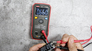 UNI-T UT123D Smart Digital Multimeter – Auto-Identify, EBTN Display, AC/DC Voltage, Capacitance, Resistance, NCV, Diode & Continuity, One-Button Operation - with red and black probes, showing 0.660 mF on its EBTN display.