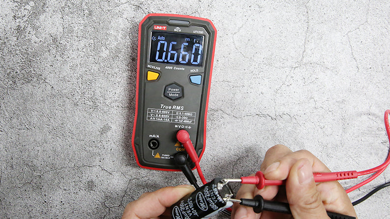 UNI-T UT123D Smart Digital Multimeter – Auto-Identify, EBTN Display, AC/DC Voltage, Capacitance, Resistance, NCV, Diode & Continuity, One-Button Operation - with red and black probes, showing 0.660 mF on its EBTN display.