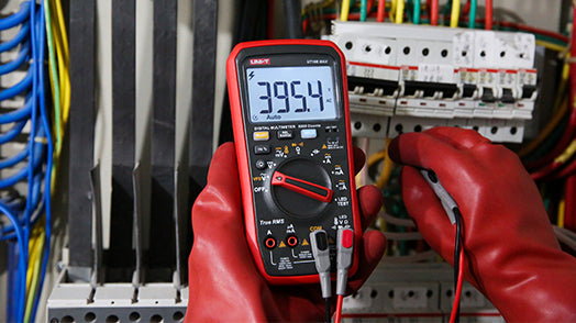 UNI-T UT18B MAX True RMS Digital Multimeter – 6000 Count, 1000V AC/DC, VFD, Temperature, LED Test, Capacitance, Frequency, EMI Protection with Gold-Plated Leads - a red casing, a rotary dial, two test leads, and a display reading 395.4.