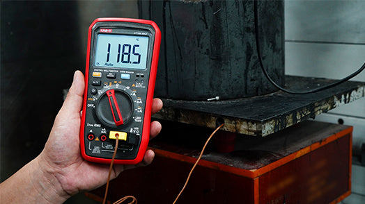 UNI-T UT18B MAX True RMS Digital Multimeter – 6000 Count, 1000V AC/DC, VFD, Temperature, LED Test, Capacitance, Frequency, EMI Protection with Gold-Plated Leads - a red and black casing, a central rotary dial, and a screen displaying 118.5 degrees Celsius.