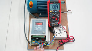 UNI-T UT18B PRO True RMS Digital Multimeter – 6000 Count, 1000V AC/DC, VFC, Temperature, LED Test, CAT III 1000V / CAT IV 600V, 8kV Anti-Burn Protection - measuring 400.4V on a motor controller, showing a red and black handheld unit with a digital display.