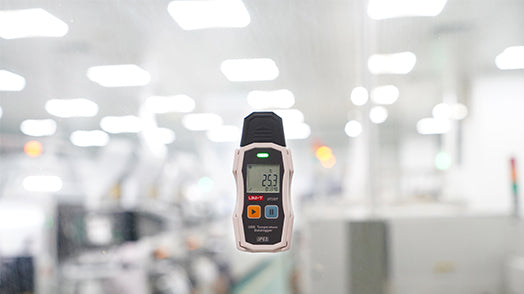 UNI-T UT330T USB Temperature Datalogger – −30°C to 70°C, ±0.4°C, 64,000-Set Memory, IP65, PDF/XLS Export, Adjustable Interval, LED Alarm, Reusable - a white and black handheld device with a digital display reading 25.3 and two control buttons.