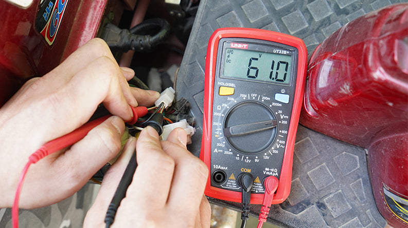 UNI-T UT33B+ Palm Size Digital Multimeter – 2000 Count, AC/DC Voltage & Current, Battery Test, Resistance, Diode & Continuity, CAT II 600V, 2m Drop-Proof - a 61.0V reading on the display while probes are connected to electrical wiring.