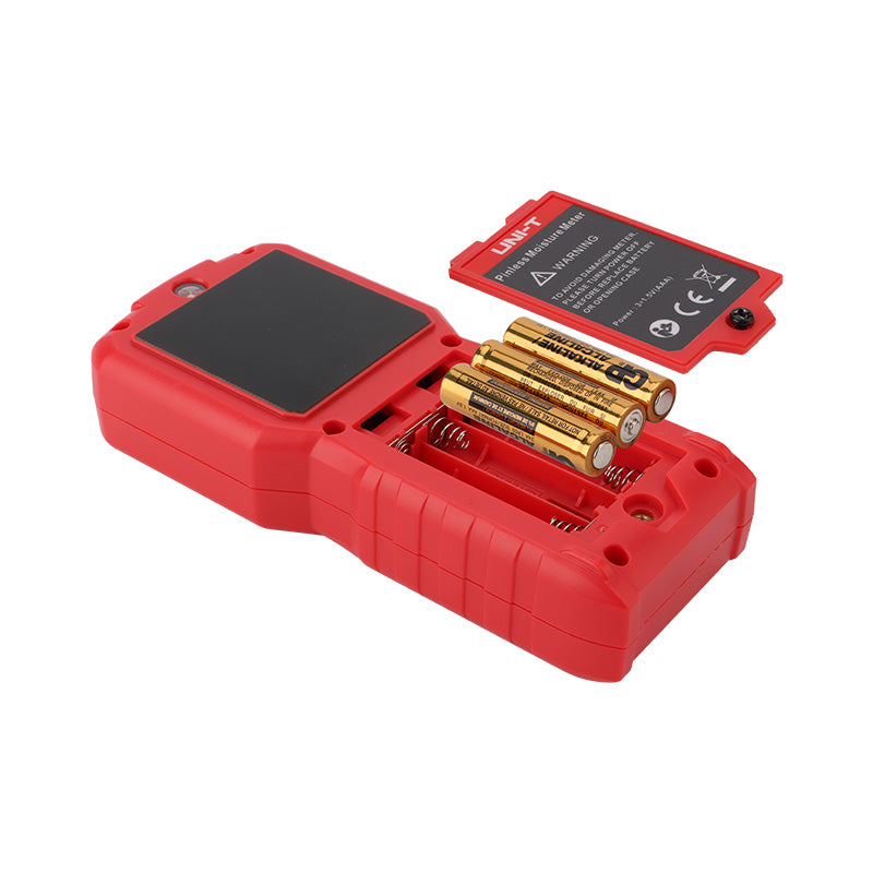 UNI-T UT377C Pinless Moisture Meter – Non-Destructive, Softwood / Hardwood / Drywall / Masonry, 50×50 mm Sensor, EBTN Colour Screen, Temp, Flashlight - shown from the back with its red battery compartment cover open, revealing three AAA batteries inside.