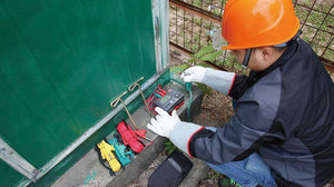 UNI-T UT522 Earth Resistance Tester – Digital Earth / Ground Resistance Meter - a digital display, red, yellow, and green test leads, and two metal ground stakes.