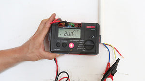 UNI-T UT526 Multifunction Electrical Tester – Multifunction Installation Tester, 250V/500V/1000V - a digital display reading 200 MΩ, a red test button, and connected test leads.