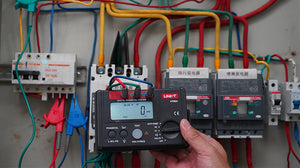 UNI-T UT582+ RCD / ELCB Tester – Digital RCD / ELCB Trip Tester - a digital display reading 0ms, a rotary function knob, test buttons, and three top input ports.