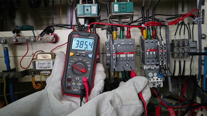 UNI-T UT60EU True RMS Digital Multimeter – 9999 Count, AC/DC 1000V, 10A, Capacitance, Frequency, Temperature, NCV, 3-Color LED Alert, CAT III 600V - a 385.4V reading on the screen, a central rotary dial, and red and black probes.