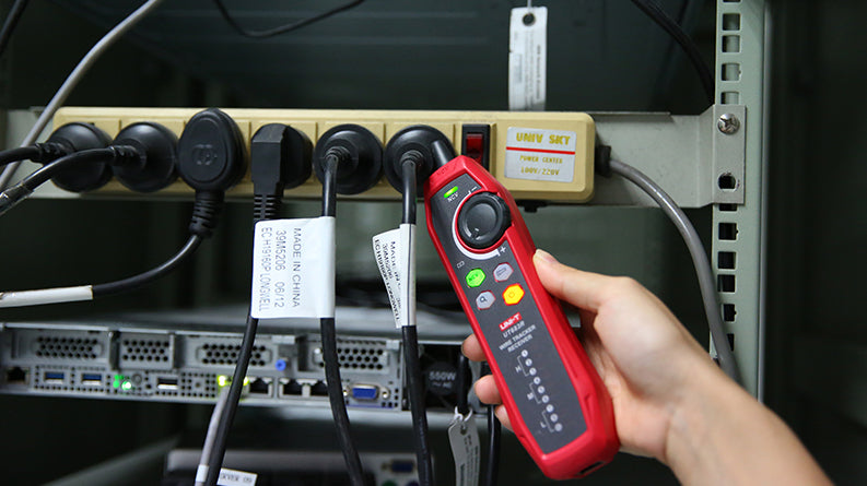 UNI-T UT683KIT Wire Tracker Kit – RJ11/RJ45 Wire Tracing, Port Flashing, NCV, Open/Short & Polarity Test, Rechargeable Cable Toner and Probe - receiver held in a hand, showing its red casing, NCV button, indicator lights, and probe tip near a power strip.