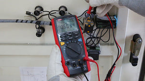 UNI-T UT71C High-Precision Intelligent True RMS Digital Multimeter – 40000 Count, AC/DC 1000V, 0.025% Accuracy, 400MHz, Temperature, USB & Bluetooth - with a red and black casing, showing a digital display reading 0.6034 while testing a component with two probes.