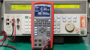UNI-T UT725 Multifunction Process Calibrator – mA, V, Temperature (TC/RTD), Frequency, Resistance, Pulse Source &amp; Measure, 20000 Count - connected to a benchtop instrument showing 15.001 mA on its digital display.