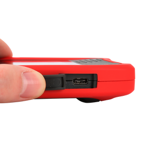 UNI-T UTI720T Portable Thermal Camera – 256×192, -20°C to 550°C, ≤50MK - close-up of a hand holding the red device to reveal an open rubber cover exposing the USB-C charging port.
