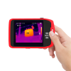UNI-T UTI720T Portable Thermal Camera – 256×192, -20°C to 550°C, ≤50MK - held in a hand, featuring a red frame, a side-mounted button, and a screen displaying a thermal image of a transformer.