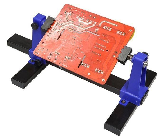 Universal PCB Stand Holder ZD-11E - a red circuit board held between two blue adjustable supports mounted on a black metal base.
