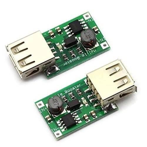 USB 1200 mA DC 2V To 5V To DC 5V Voltage Step Up Boost Converter Module - two small green circuit boards with USB ports and electronic components.