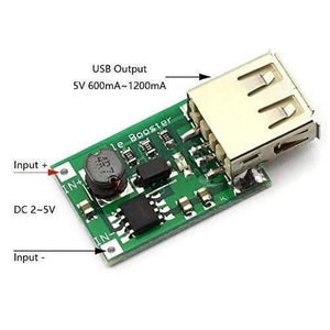 USB 1200 mA DC 2V To 5V To DC 5V Voltage Step Up Boost Converter Module - a green circuit board with a USB port and labeled input pads.