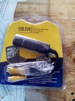 USB 2.0 Easycap 4 Channel Dvr Cctv Camera Audio Video - the device and attached yellow RCA cables.