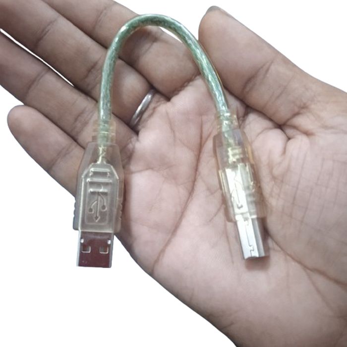USB Cable For Arduino Uno Arduino - a short, transparent-cased USB-A to USB-B cable held in a hand.