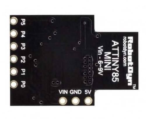 USB Digispark ATTINY85 Developing Board - shown from the bottom, featuring a black PCB with labeled P0-P5 pins and VIN, GND, and 5V connection points.