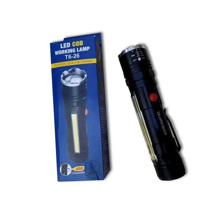 USB Rechargeable Zoomable LED Flashlight Camping Torch Lamp T6-26 USB Charge - shown with its blue cardboard packaging box and the black metal flashlight with a red side button.