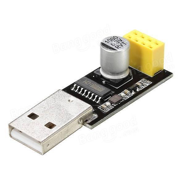USB To ESP8266 Serial Adapter Wireless WiFi Development Board Transfer Module - a silver USB connector, a cylindrical capacitor, and a yellow multi-pin header.