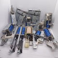 Used 1 Piece DC Solenoid Electromagnet In Mix Shape - a collection of various metal and blue plastic DC solenoid actuators with springs and levers.