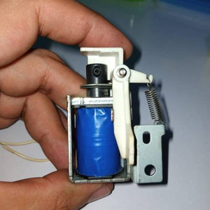 Used 1 Piece DC Solenoid Electromagnet In Mix Shape - a blue-wrapped coil, a metal frame, a white plastic lever, and a tension spring.