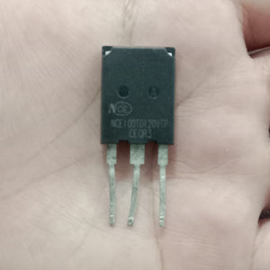 Used 100A NCE 100TD120VTP IGBT - a black three-pin electronic component held in a hand, showing the printed model number and specifications on its front face.