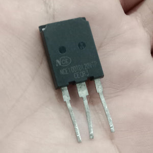 Used 100A NCE 100TD120VTP IGBT - a black, rectangular three-pin electronic component held in a hand, showing the printed model number on its front surface.