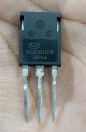 USED 1200V 100A NCE100TD120VTP Trench Fs II Fast IGBT – High-Performance Module for PV Power Systems - a black three-pin electronic component held in a hand with the model number printed on its front surface.