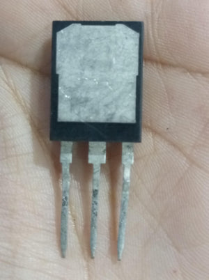USED 1200V 100A NCE100TD120VTP Trench Fs II Fast IGBT – High-Performance Module for PV Power Systems - a black three-pin electronic component with a metallic rectangular heat sink, held in a hand.