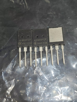 Used 200A 750V AKQ20FCP IGBT with Diode-Digilog.pk - three black electronic components with four metal pins each, resting on a crinkled plastic surface.