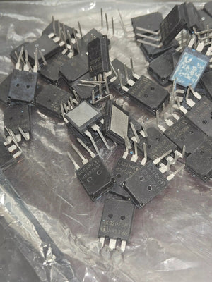 Used 200A 750V AKQ20FCP IGBT with Diode-Digilog.pk - a pile of black, three-pin electronic components inside a clear plastic bag.