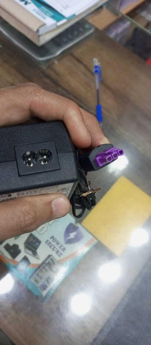 Used 32V Adapter Power Supply With 220V Power Cable - a close-up of the black adapter brick and its purple-accented power connector cable.