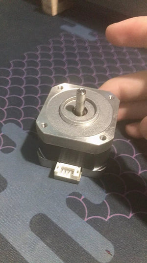 Used 4 Wire NEMA 17 5mm Shaft Bipolar Stepper Motors - shown from a top-down angle, featuring a silver metal body, a central shaft, and a white 4-pin connector.