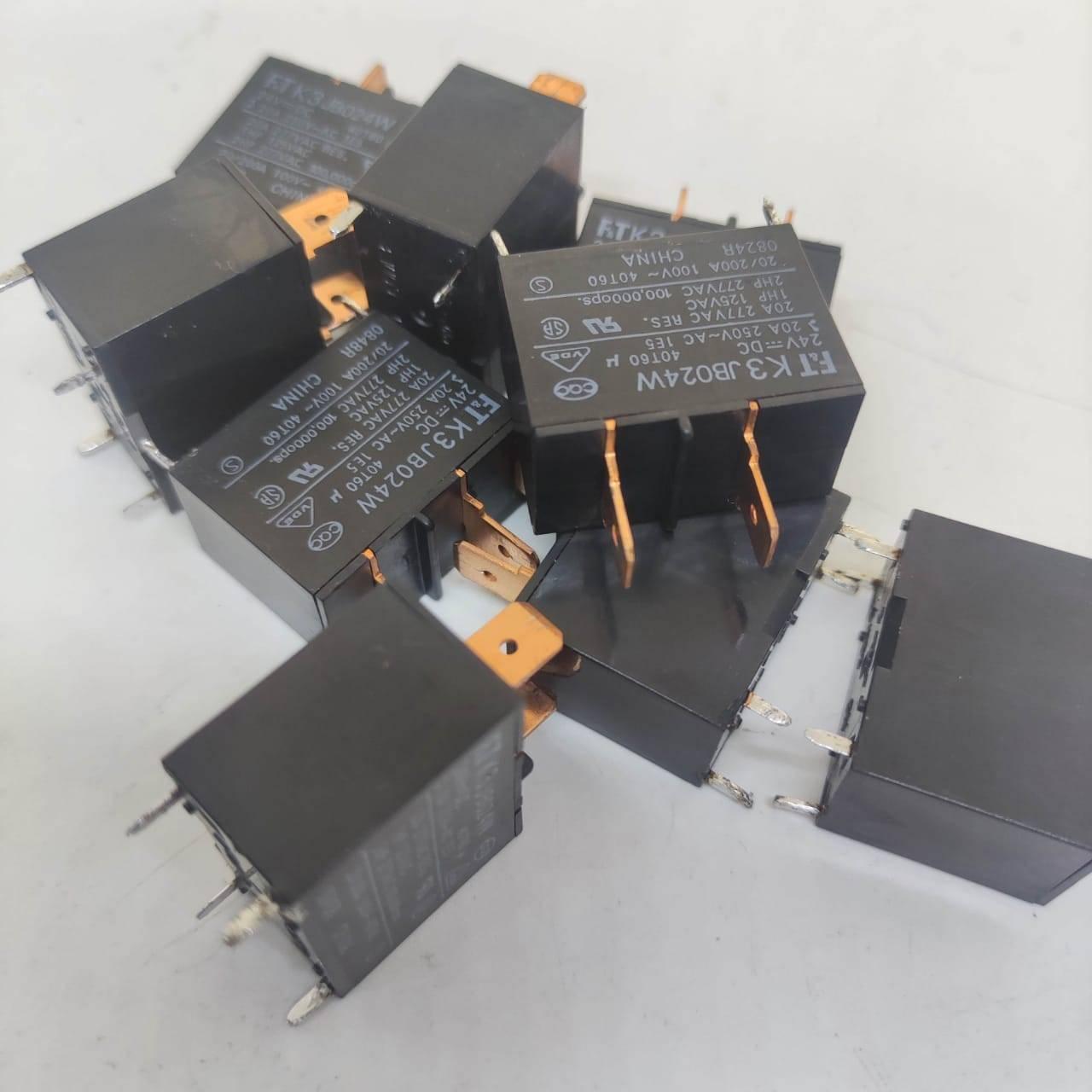 USED Fujitsu Japan JB024W 24V 20A Relay Switch High Current Relay POWER RELAY - a pile of several black rectangular power relays with metal contact pins and printed technical specifications.