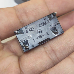 USED Fujitsu Japan JB024W 24V 20A Relay Switch High Current Relay POWER RELAY - a close-up view of the black rectangular casing showing terminal labels 4 NO, COM 3, and coil pins 1-2.