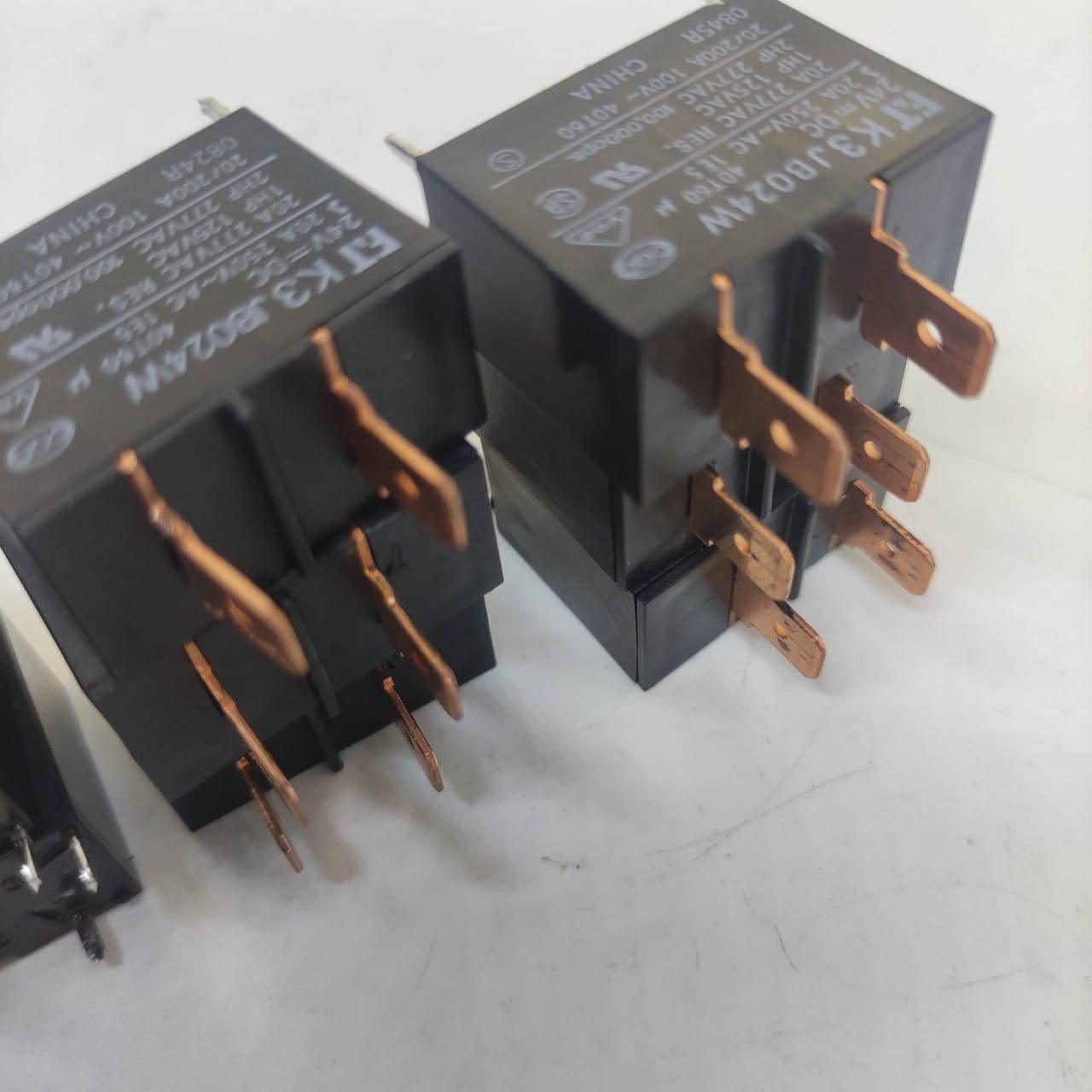 USED Fujitsu Japan JB024W 24V 20A Relay Switch High Current Relay POWER RELAY - two black rectangular power relays with copper-coloured electrical spade terminals.